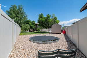 View of yard with a trampoline