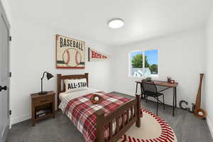 Carpeted bedroom with baseboards