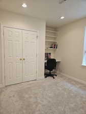 Office space with light colored carpet