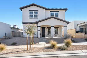 View of front of home featuring a porch and central AC