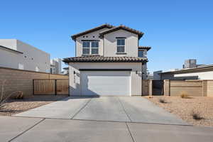 View of front of property featuring a garage