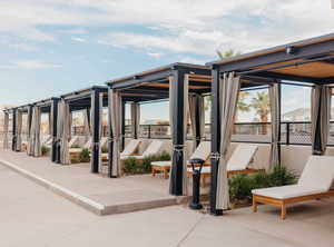 View of patio / terrace featuring a sunroom