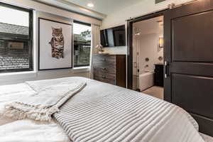 Bedroom with a barn door