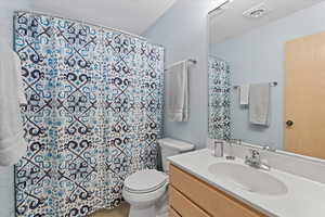 Bathroom with vanity and toilet