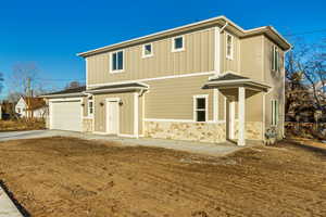 View of property with a garage