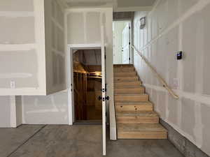 Stairs from garage to unfinished basement