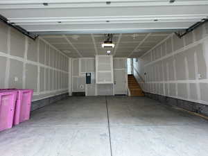 Garage featuring a garage door opener