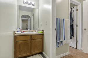 Bathroom featuring vanity and tile patterned floors