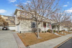 Front of property with covered porch and a garage