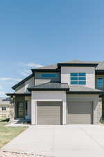 Prairie-style house featuring a garage