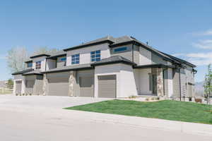 Prairie-style house featuring a garage