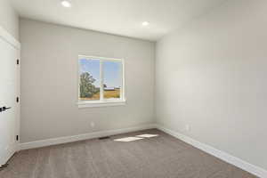 Empty room featuring carpet flooring