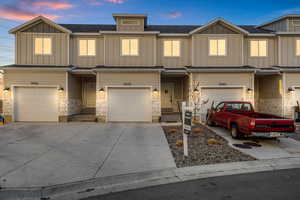 View of front of property featuring a garage