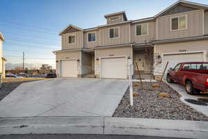 View of front of property featuring a garage