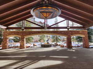 View of home's community with an outdoor fire pit and a patio area