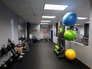 Exercise room featuring a drop ceiling