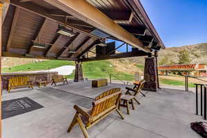 View of patio with a gazebo and a mountain view