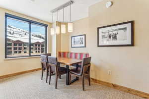 View of carpeted dining space