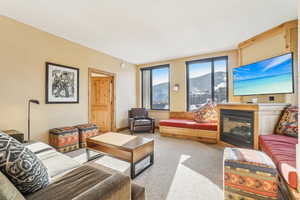 Living room featuring light carpet