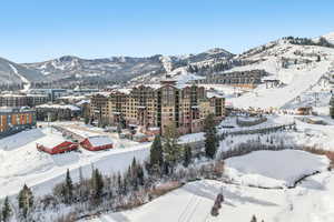 Snowy aerial view featuring a mountain view