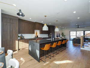 Galley style kitchen.  Paneled Sub Zero refrigerator, Wolf stove, full size cabinet pantry, custom cabinetry