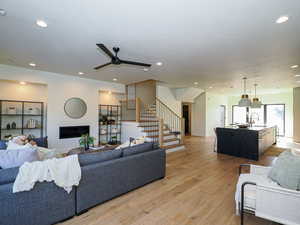 Oversized family room with recessed areas for book cases and gas fireplace