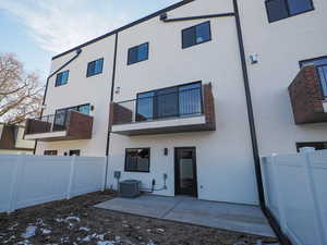 Rear view of house featuring patio.