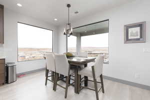 Dining space with plenty of natural light and light wood-type flooring