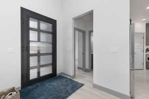 Foyer featuring light hardwood / wood-style floors