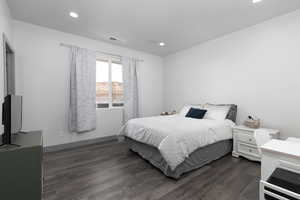 Bedroom featuring dark hardwood / wood-style floors