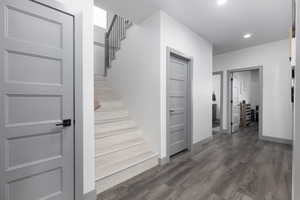 Stairs featuring wood-type flooring