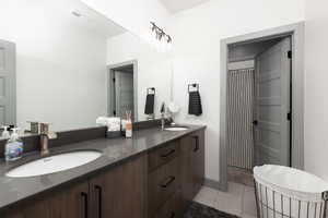 Bathroom featuring tile patterned floors and vanity