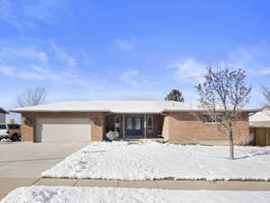 Ranch-style house featuring a garage