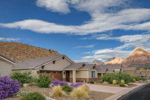 View of front of home featuring a mountain view and a garage