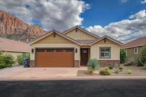 Craftsman-style home with a mountain view and a garage