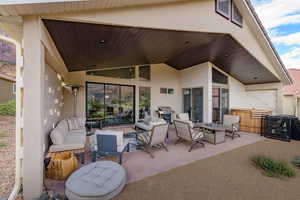 View of patio / terrace featuring outdoor lounge area and a grill