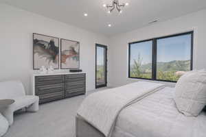 Bedroom with light carpet, a chandelier, access to outside, and recessed lighting