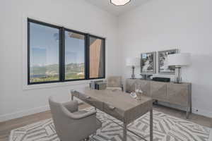 Home office featuring light wood-style floors and baseboards