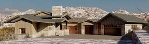 View of front of property featuring a mountain view and a garage