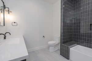 Bathroom with vanity and shower / washtub combination