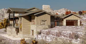 View of front of property with a mountain view, a garage, and a balcony