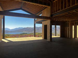 Interior space with a water and mountain view