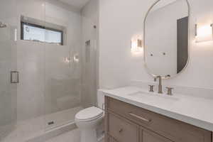 Bathroom featuring vanity and a stall shower