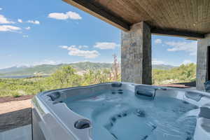Exterior view of a mountainous background and a hot tub
