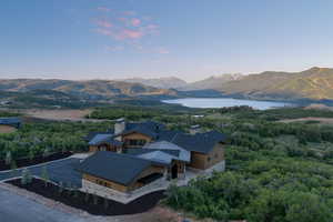 View of mountain backdrop featuring a large body of water