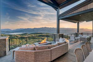 View of patio with an outdoor living space with a fire pit and a mountain view