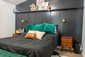 Bedroom with light colored carpet