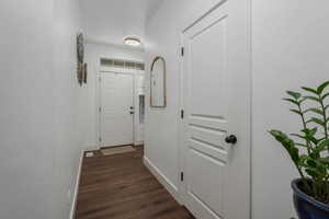 Hall featuring dark hardwood / wood-style floors