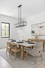 Dining area with light hardwood / wood-style flooring