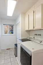 Laundry room with cabinets and pantry